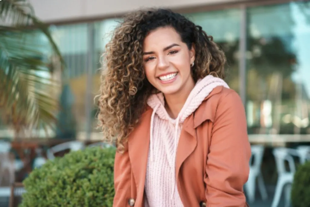 A woman smiling