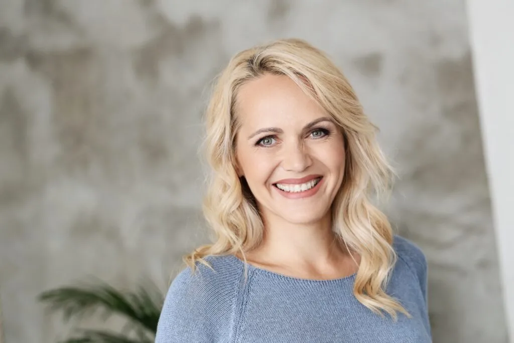 A woman smiling